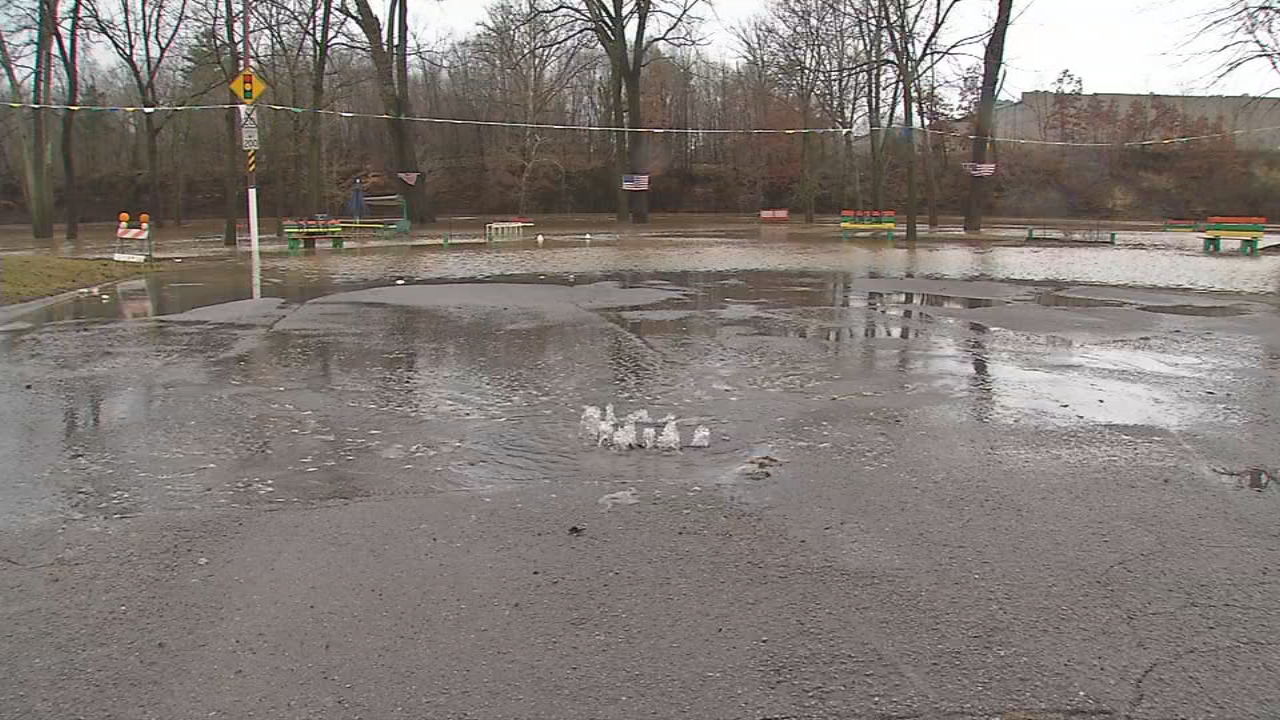 Sewage spills onto street after flooding